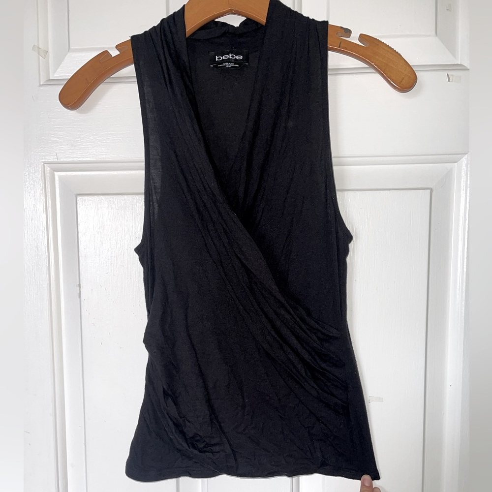 Bebe sleeveless wrap top size XS in black